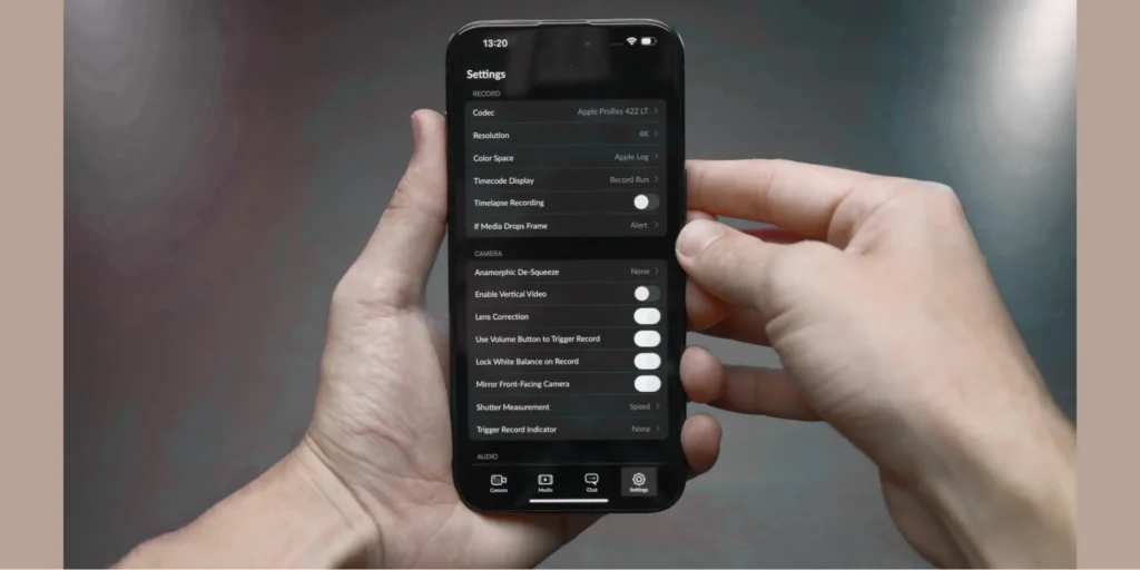 Close-up of a person adjusting settings on an iPhone, demonstrating iPhone parental control features for managing screen time, privacy, and content restrictions for children